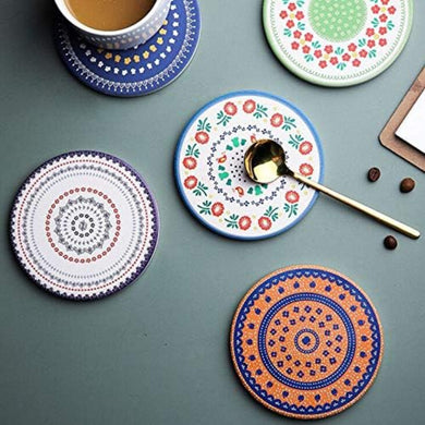 Set of colorful coasters with intricate patterns on a gray surface.