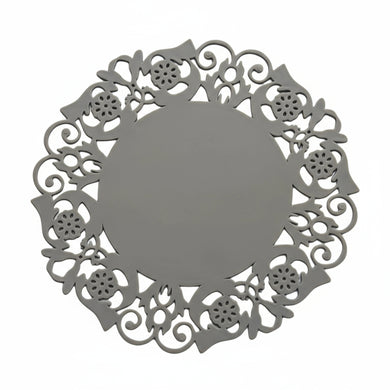 Decorative brown metal round object with intricate cut-out patterns on a white background