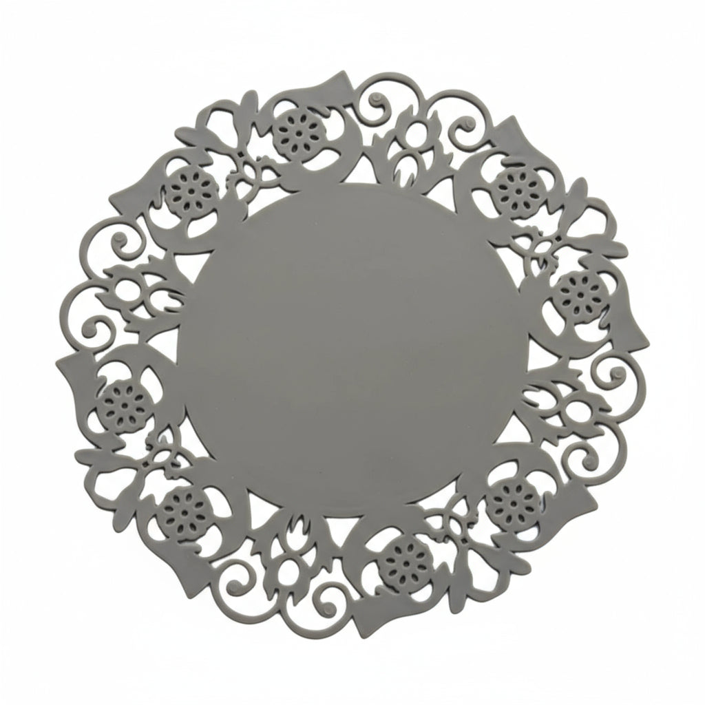 Decorative brown metal round object with intricate cut-out patterns on a white background