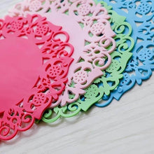 Load image into Gallery viewer, Decorative cut-out paper shapes in pink, green, and blue on a white surface
