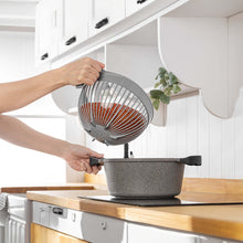 Load image into Gallery viewer, Handled multi-purpose bowl draining water over a cooking pot
