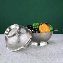 Load image into Gallery viewer, Metallic colander with fruits and vegetables on a gray surface against a green background
