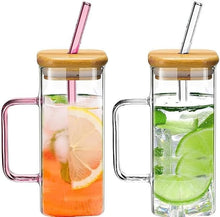Load image into Gallery viewer, Heat resistant glass tumblers with bamboo lid and colored straws, perfect for hot or cold beverages.
