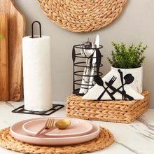 Load image into Gallery viewer, Kitchen counter with pink plates, cutlery, and a woven basket.
