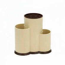 Load image into Gallery viewer, Beige and black cylindrical holder with a label on a white background
