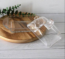 Load image into Gallery viewer, Clear glass container with a wooden base on a light wooden surface.
