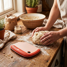 Load image into Gallery viewer, Multipurpose dough scraper and cutter in packaging, featuring a red handle and measurement markings for kitchen baking.

