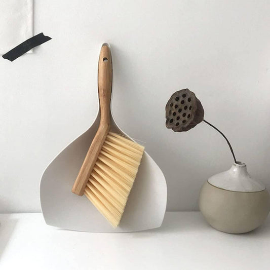 Dustpan set with bamboo handle brush and shovel, ideal for compact household cleaning.