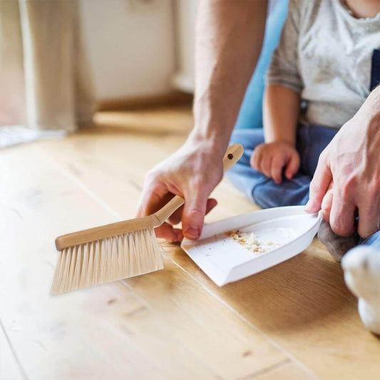 Dustpan set with bamboo handle and shovel, ideal for effective household cleaning.