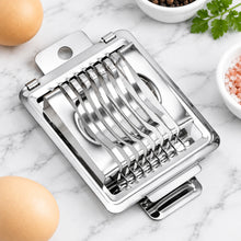 Load image into Gallery viewer, Metallic kitchen slicer with eggs and minced meat on a light surface
