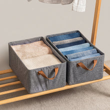 Load image into Gallery viewer, Grey fabric storage boxes holding towels and clothing
