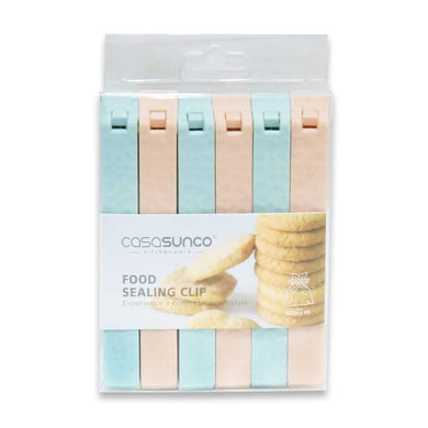 A pack of six food sealing clips in varying shades of pink and green, presented in a clear plastic packaging with a product label.