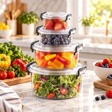 تحميل الصورة في عارض المعرض، A set of four transparent plastic storage containers with corresponding black lids, stacked in a pyramid shape. The containers are marked with volume measurements.
