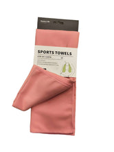 Load image into Gallery viewer, Pink sports towel with packaging on a white background
