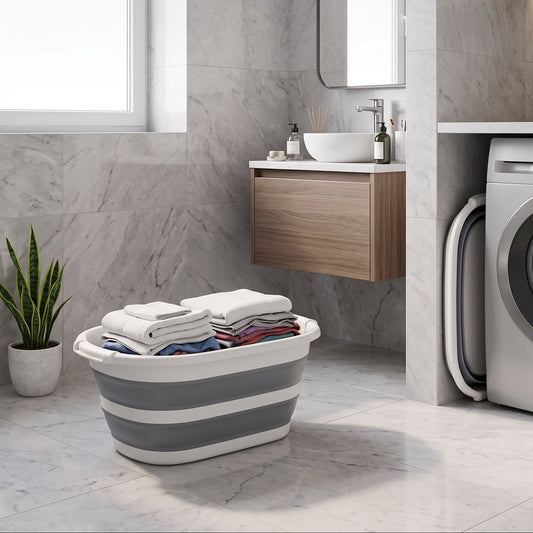 Collapsible laundry basket holding towels in a bathroom