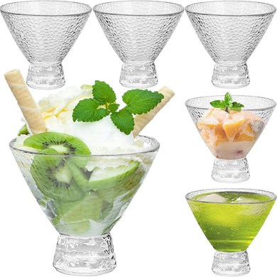 Set of clear glass dessert bowls with various contents including ice cream, fruit, and a drink.