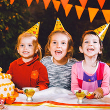 Load image into Gallery viewer, Three children wearing party hats at a birthday party with a cake and decorations.

