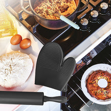 تحميل الصورة في عارض المعرض، Silicone oven mitt and brush on a kitchen counter with cooking items.
