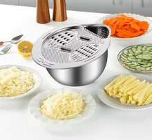 Load image into Gallery viewer, Spiralizer with various spiralized vegetables on a white surface
