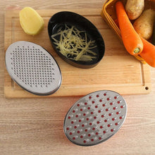 تحميل الصورة في عارض المعرض، Two metal graters on a wooden surface with vegetables and a bowl of grated items.
