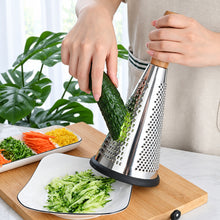 Load image into Gallery viewer, Cone grater with wooden handle grating cucumber
