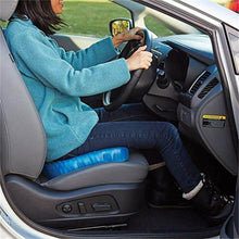 تحميل الصورة في عارض المعرض، Person sitting in a car with a blue cushion on the seat
