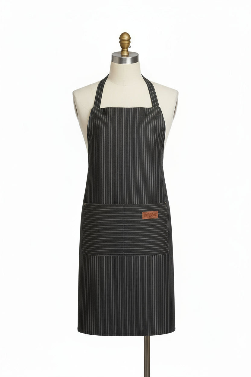 Black apron with a brand logo on a white blanket