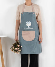 Load image into Gallery viewer, Person wearing a blue apron with a cartoon character and &#39;Happy Endy&#39; text, holding flowers against a white background.
