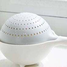 تحميل الصورة في عارض المعرض، White ceramic tea infuser with perforated lid on a white background
