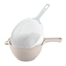 تحميل الصورة في عارض المعرض، A kitchen strainer set consisting of a white plastic colander with a handle and a beige plastic bowl, shown on a solid white background.

