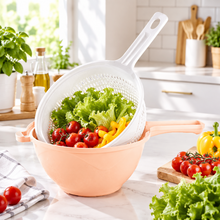 تحميل الصورة في عارض المعرض، A kitchen strainer set with a peach-colored bowl and a white plastic colander with a handle, shown on a solid white background.
