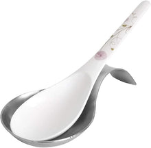 تحميل الصورة في عارض المعرض، Serving spoon with floral design on the handle against a white background

