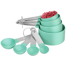 Load image into Gallery viewer, A set of measuring cups and spoons in various sizes made of stainless steel and BPA-free green plastic, displayed with a stackable design.
