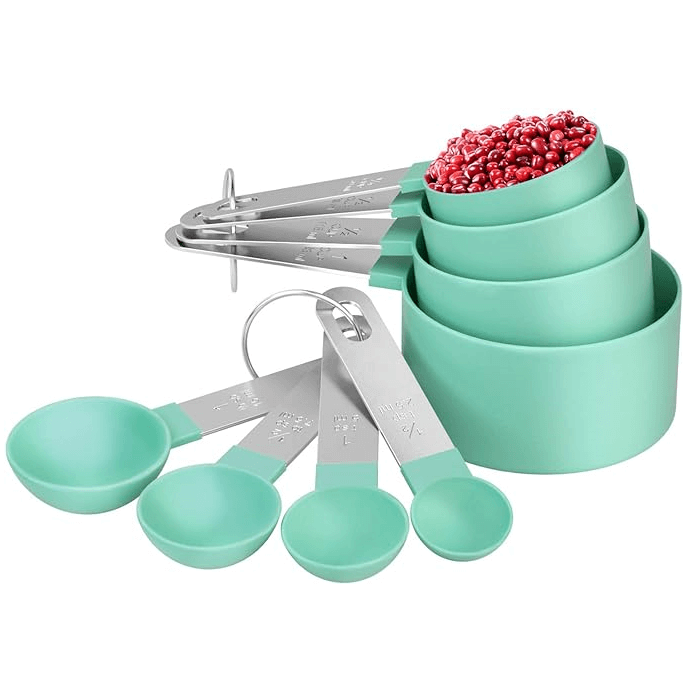 A set of measuring cups and spoons in various sizes made of stainless steel and BPA-free green plastic, displayed with a stackable design.