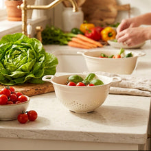 تحميل الصورة في عارض المعرض، White colander with tomatoes on a beige surface
