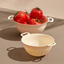 تحميل الصورة في عارض المعرض، White colander with tomatoes on a beige surface
