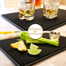 Load image into Gallery viewer, Black bar mat with glasses of whiskey and ice, and fresh fruits on a kitchen counter.
