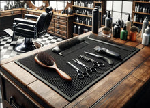 Load image into Gallery viewer, Barber tools including a comb, scissors, and hair dryer on a mat in a barbershop setting.
