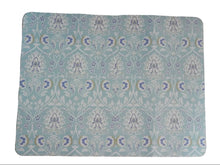 Load image into Gallery viewer, A rectangular mouse pad with rounded corners featuring a light blue and white floral damask pattern, placed on a wooden desk.

