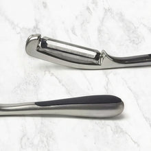 Load image into Gallery viewer, Hair cutting shears with double-edge blade and rubberized handle on a marble background
