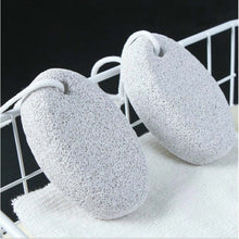 Load image into Gallery viewer, Two gray pumice stones on a white surface with a black background

