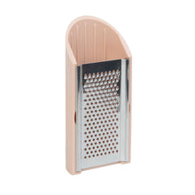 Load image into Gallery viewer, A small kitchen grater with a beige plastic frame and a stainless steel grating surface, shown on a plain white background.
