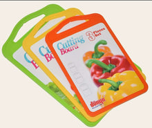 Load image into Gallery viewer, Set of colorful plastic cutting boards with a brand logo on a white background

