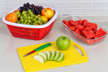 Load image into Gallery viewer, Fruits including grapes, apples, and watermelon on a white surface with a yellow cutting board.
