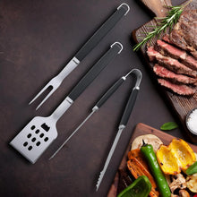 Load image into Gallery viewer, Set of barbecue utensils on a dark surface with grilled vegetables and meat.
