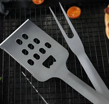 Load image into Gallery viewer, Metal spatula and fork on a grill with tomatoes
