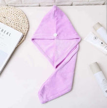 Load image into Gallery viewer, Purple hooded towel on a white surface with books and a crochet item.
