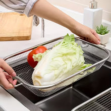 Load image into Gallery viewer, Person washing lettuce in a metal strainer over a sink
