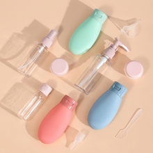 Load image into Gallery viewer, 11-piece reusable travel containers set, including spray and pump bottles in various colors, ideal for toiletries.

