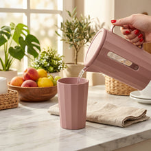 Load image into Gallery viewer, Pink electric kettle pouring water into a pink cup on a white background
